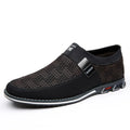Men's synthetic leather slip-on casual shoe in black, showing square toe and flat rubber sole.