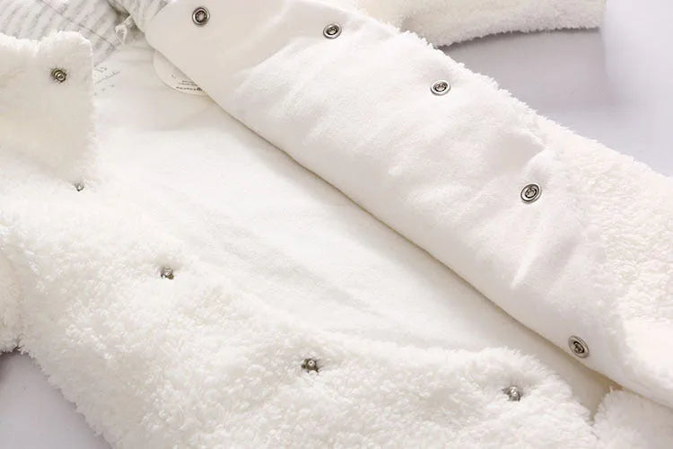 Cotton lamb baby winter romper suit in brown, showing long sleeves and feet covering.