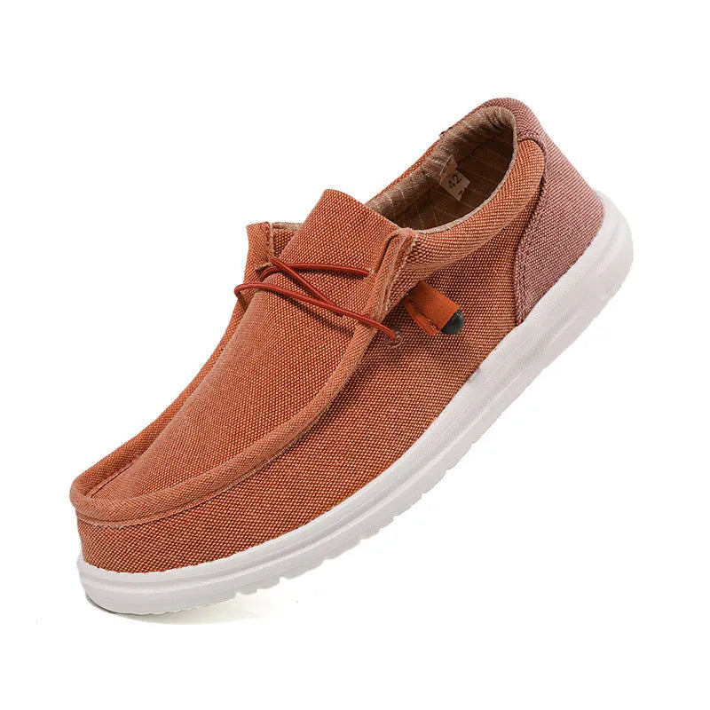 Men's green and orange canvas shoes with round toe and colour splicing detail