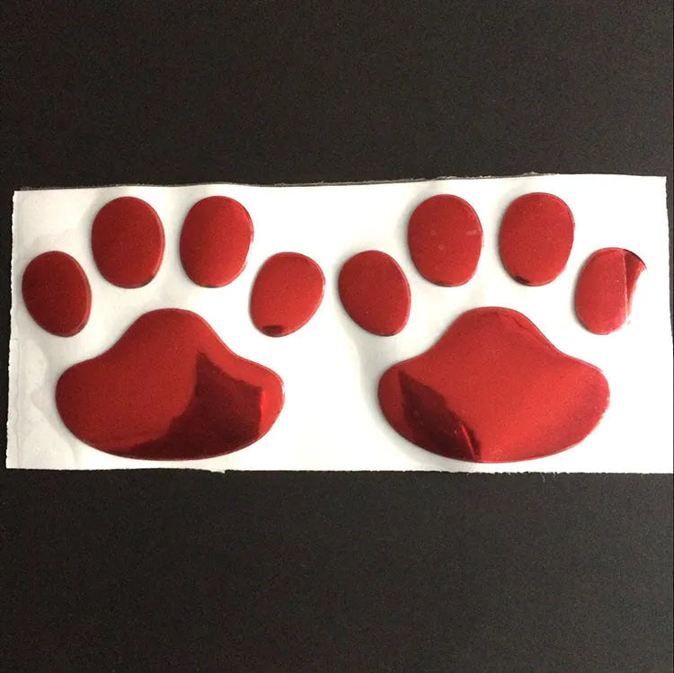 PVC car sticker pair featuring hand-shaped brush dog footprints design in choice of colours