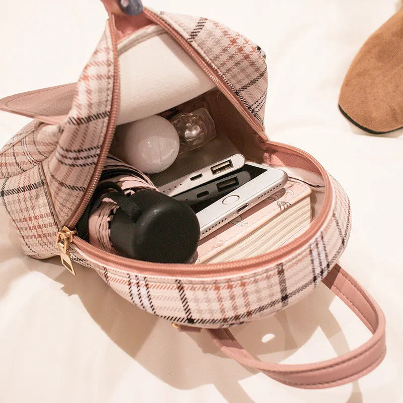A diagonal one shoulder phone bag in PU fabric, shown in a choice of five colours.