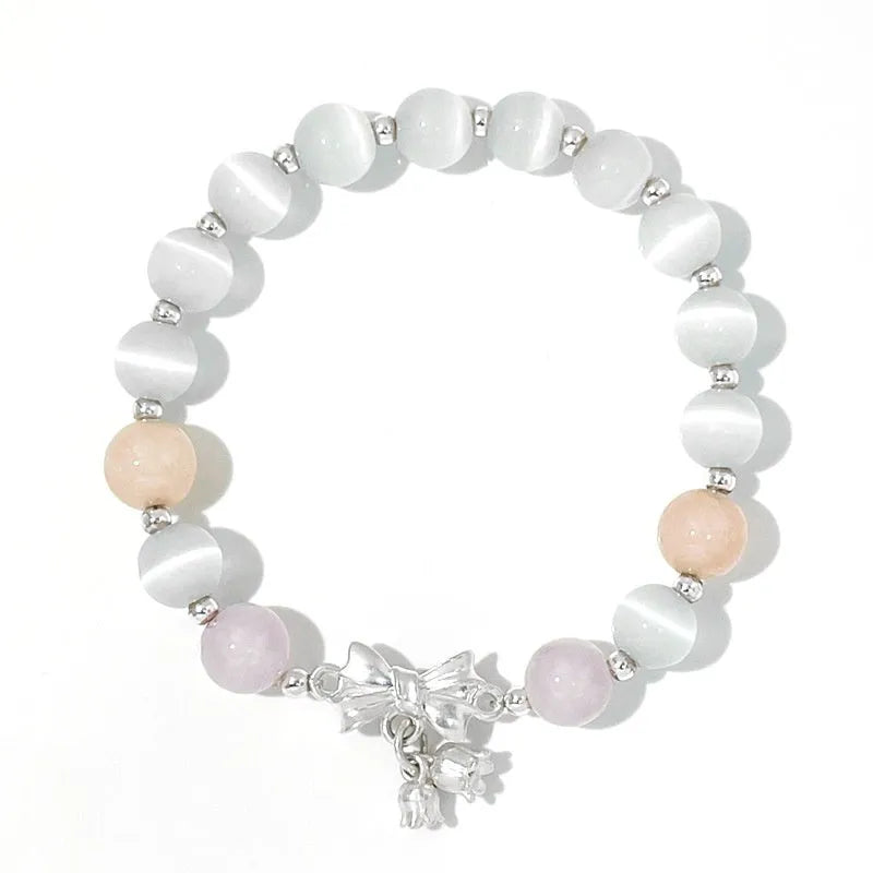 Lavender purple bowknot crystal bracelet with opal elements measuring 10mm