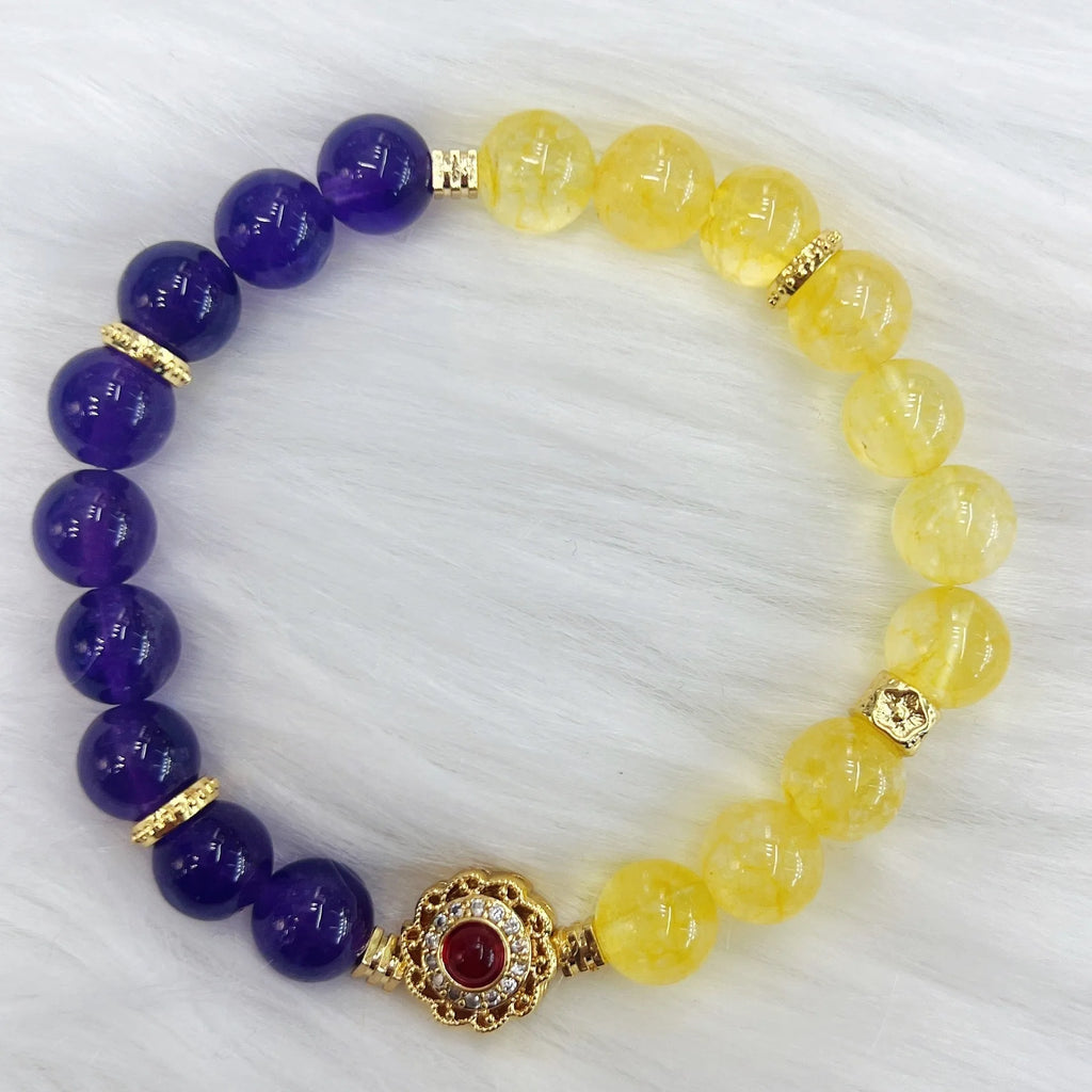 Handmade women's yellow and purple amethyst crystal bracelet showing manual craftsmanship detail