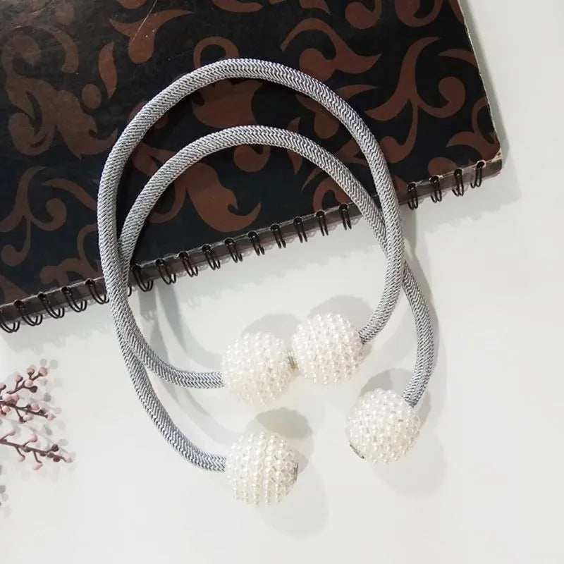 Magnetic curtain tiebacks with pearl beads in multiple colour options on white background