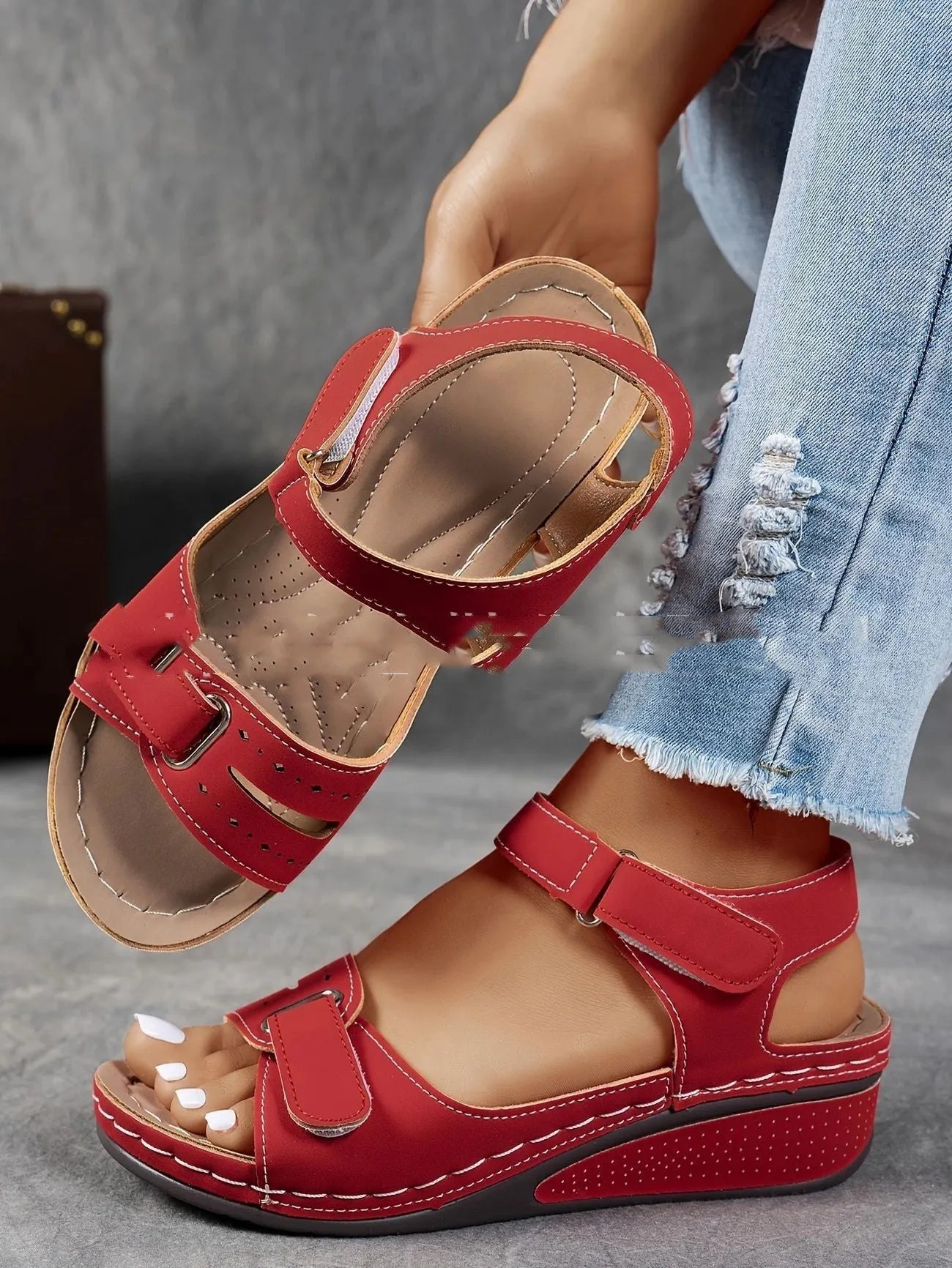 Beige wide fit sandals with thick composite sole and adjustable Velcro straps on a white background.