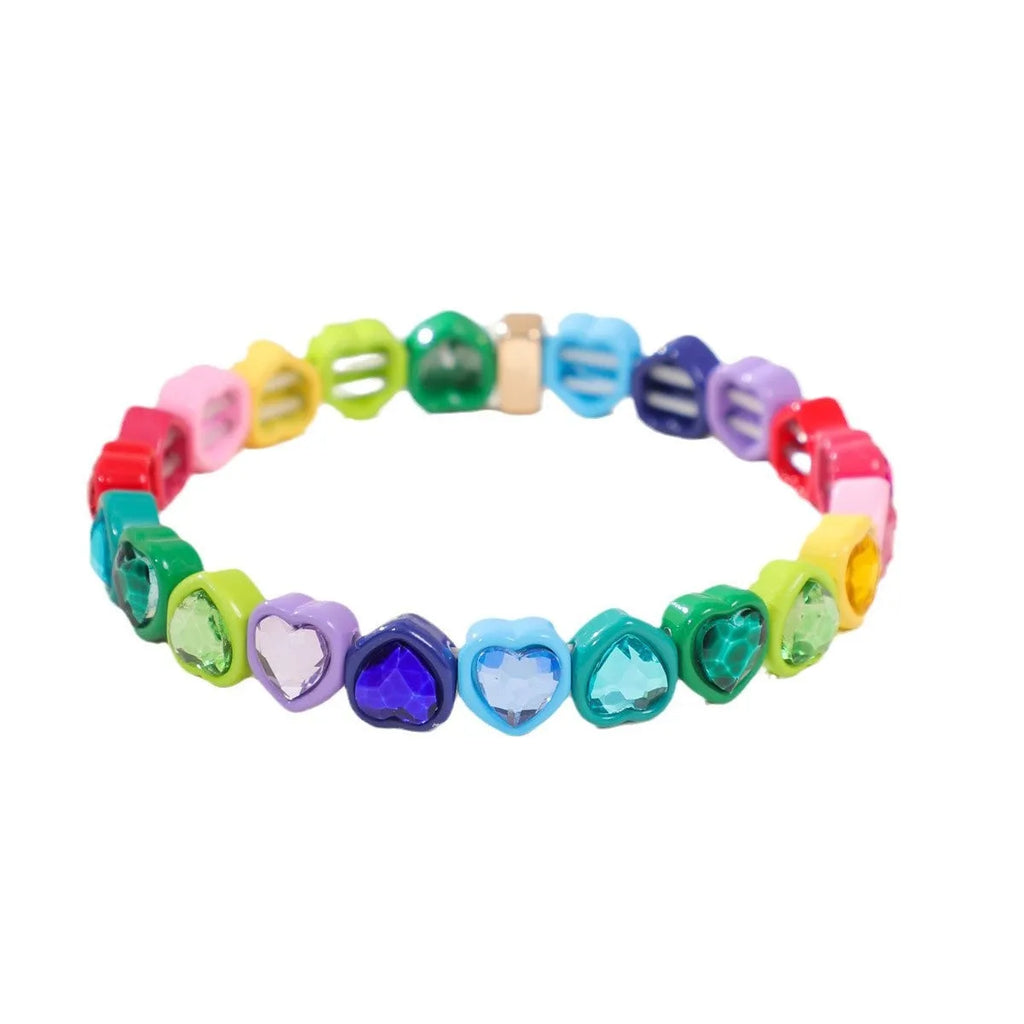 Rainbow coloured alloy heart charms on a stretchy elastic bracelet.