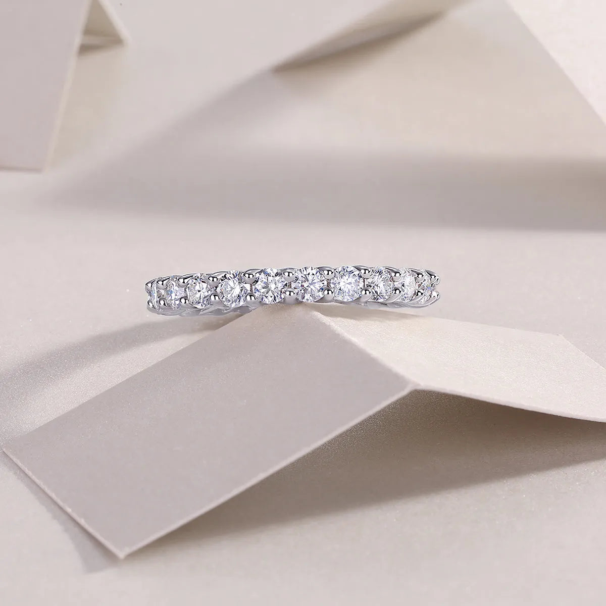 Rose moissanite wedding ring in platinum-plated S925 silver, on display with GRA certificate and gift box