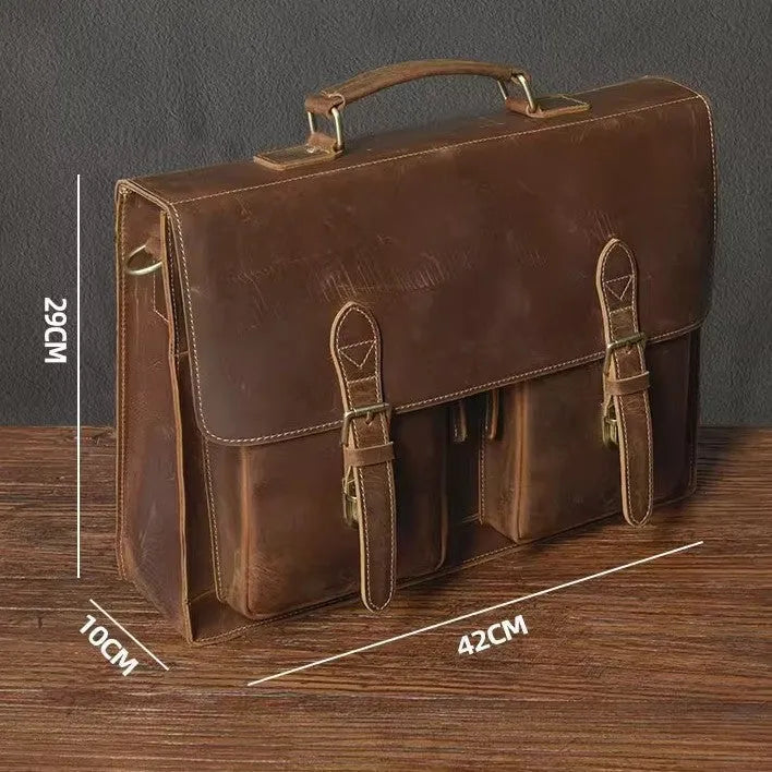 Genuine cowhide leather crossbody computer bag in solid colour with visible sewing lines