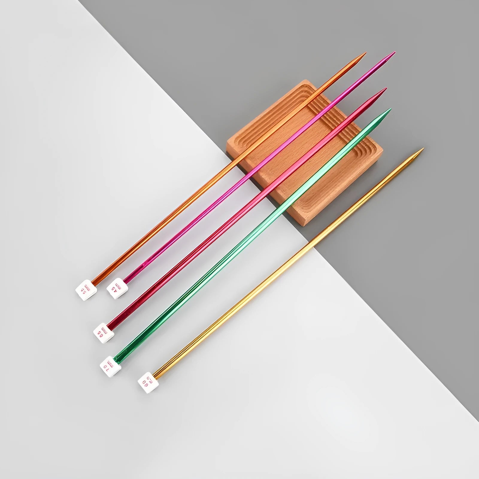 Lengthened crochet hook set showing 14 different sizes from 2.0mm to 10.0mm with protective end caps