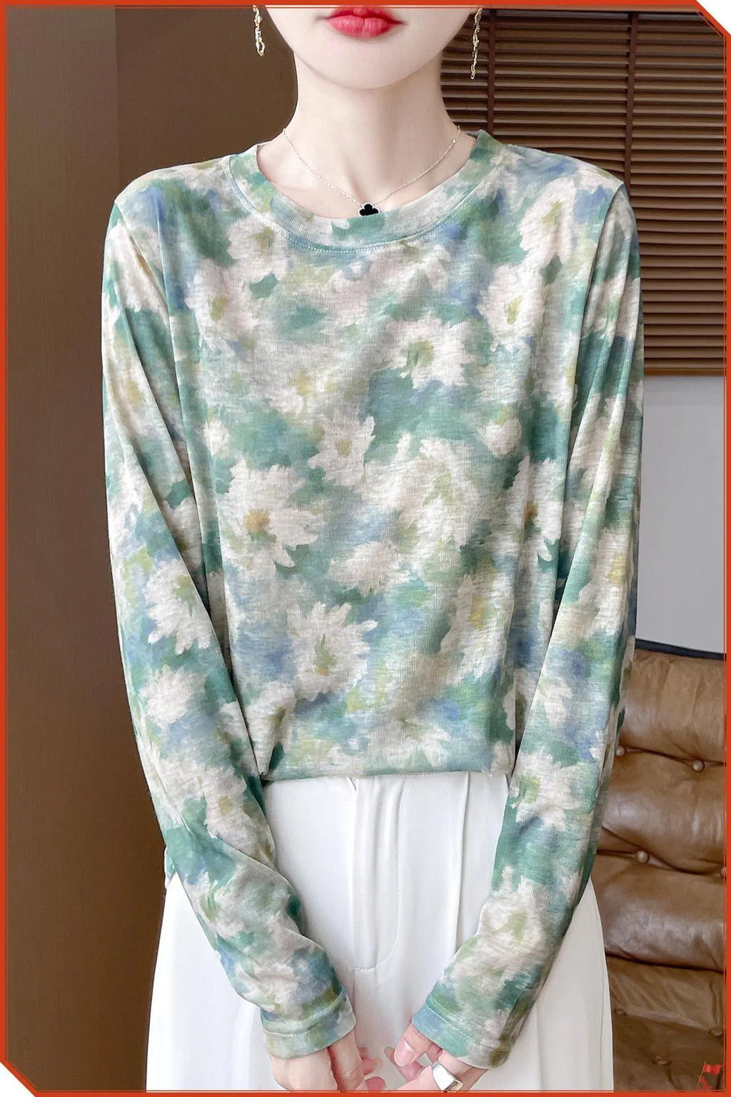 Women's round neck pullover top in a floral print Tencel cotton knitted fabric.