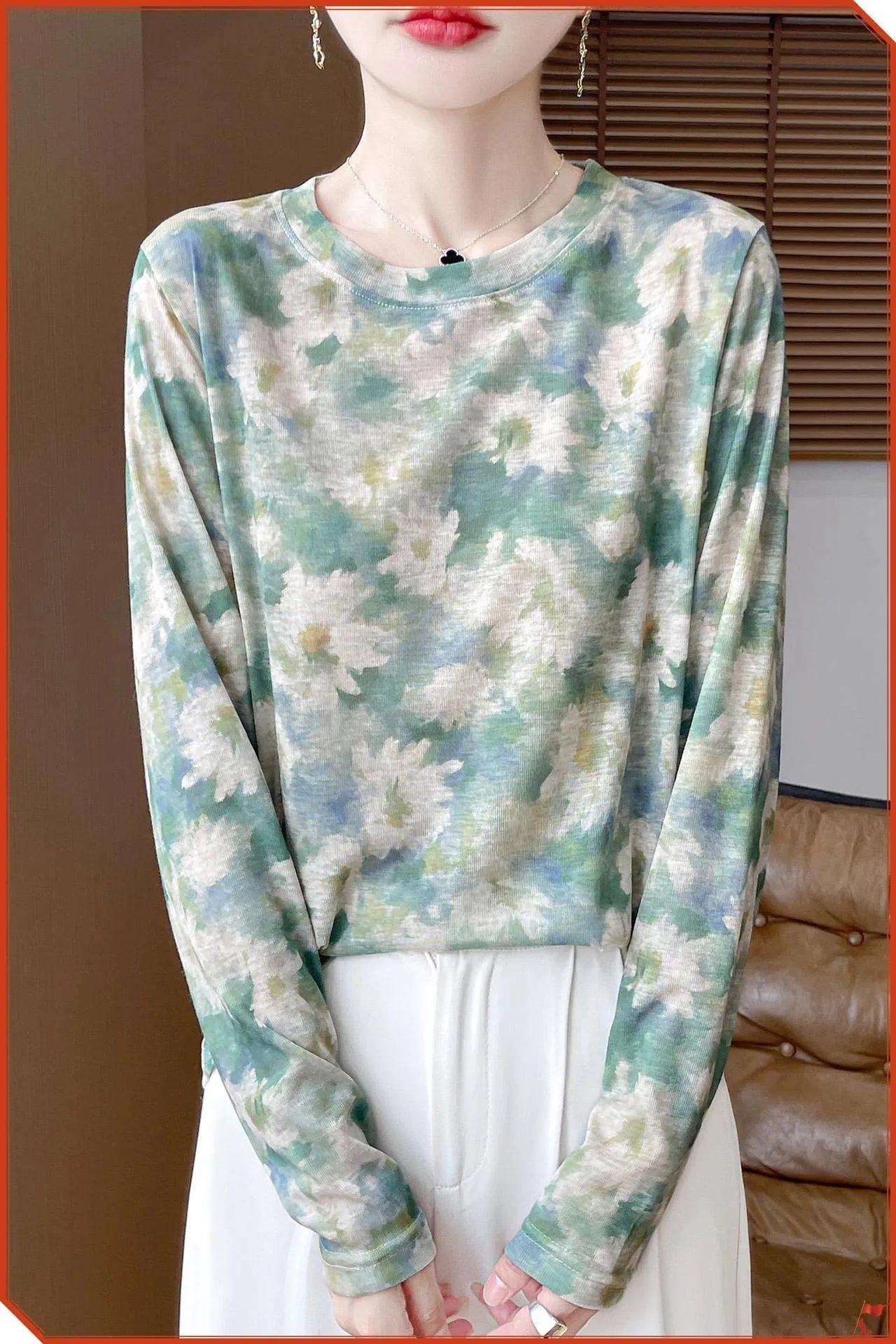 Women's round neck pullover top in a floral print Tencel cotton knitted fabric.