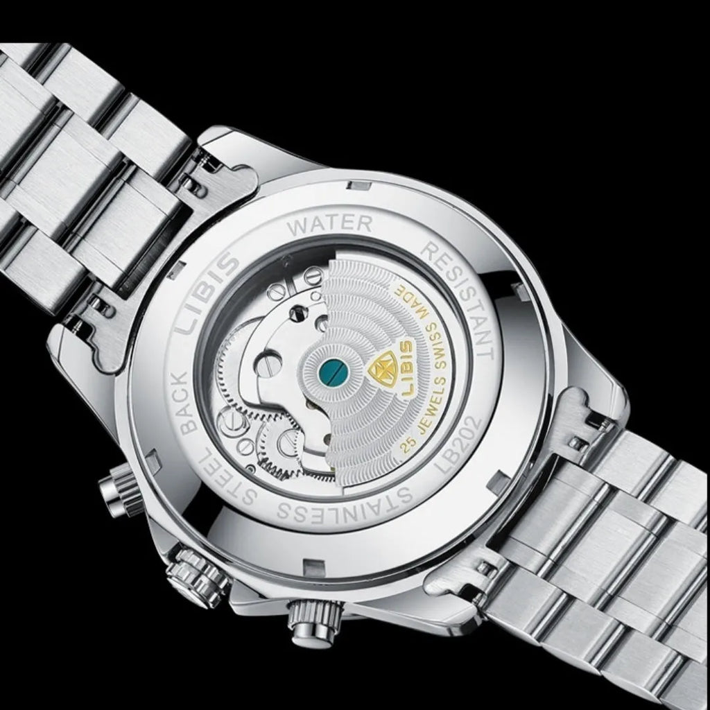 Silver men's automatic perpetual calendar mechanical watch with stainless steel strap on a wrist.