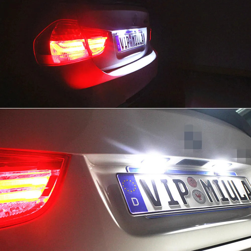 Two Volkswagen LED license plate light bulbs with SMD LEDs and plug connectors.