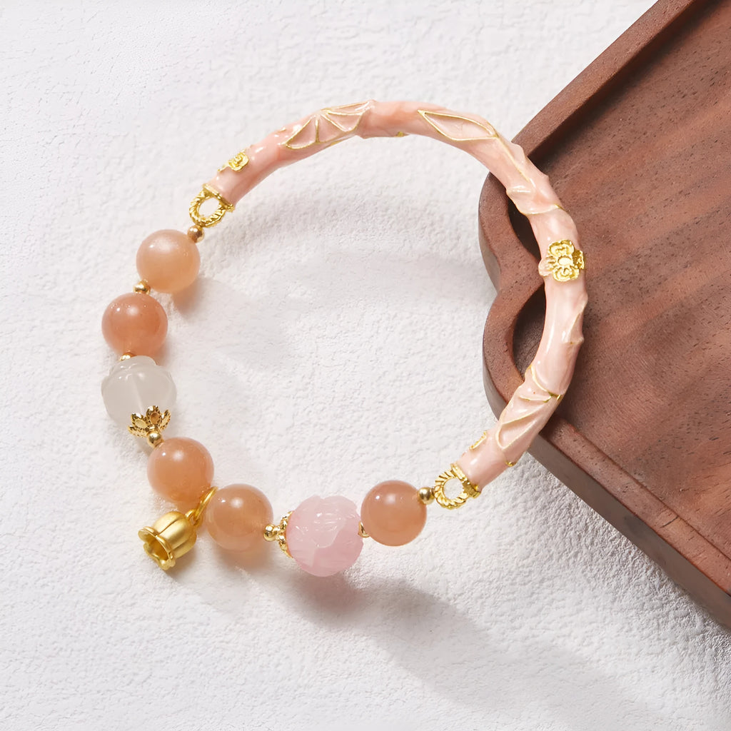 Chinese style sunstone jade bracelet with lily pattern and geometric gold thread design
