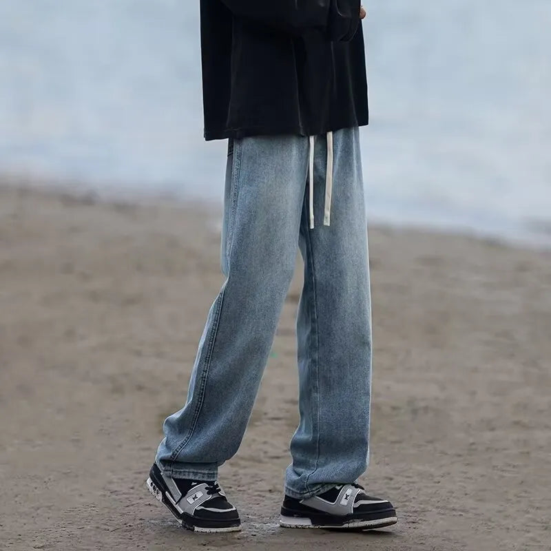 Blue straight-leg men's trousers with drawstring waist and cotton denim fabric