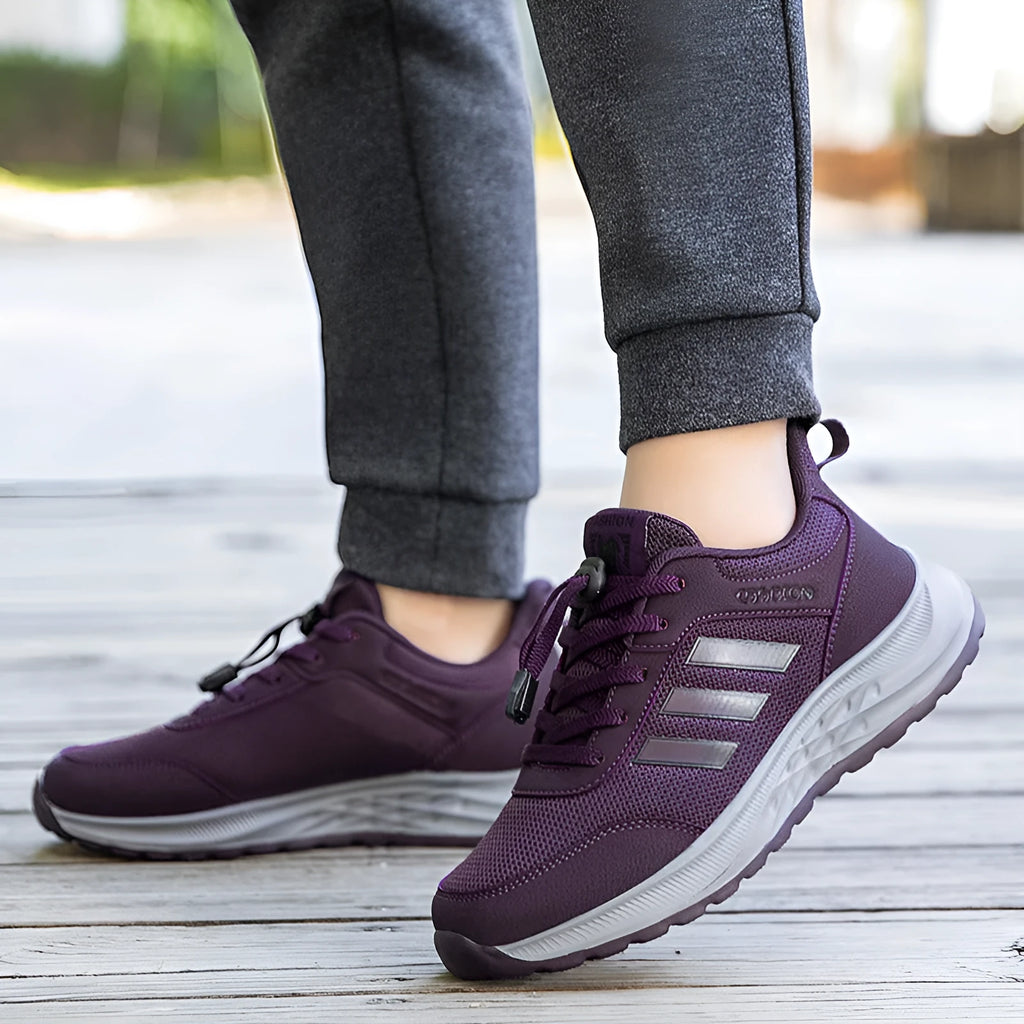 Unisex elastic band slip-on trainer with breathable mesh upper in black, dark grey, purple or purplish red.