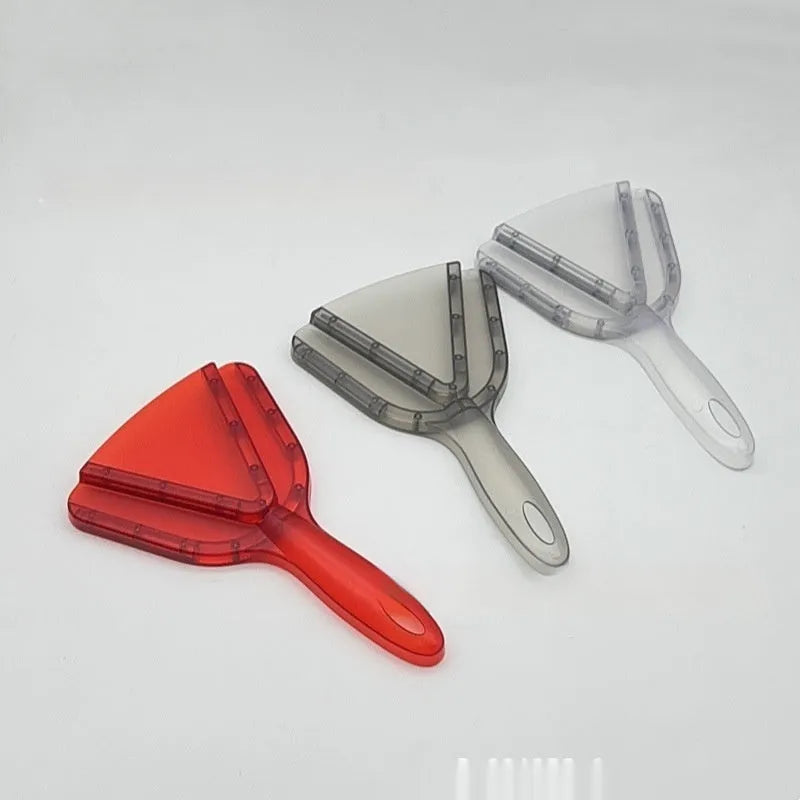 Red plastic telescopic can and bottle opener with non-slip handle on a kitchen counter.
