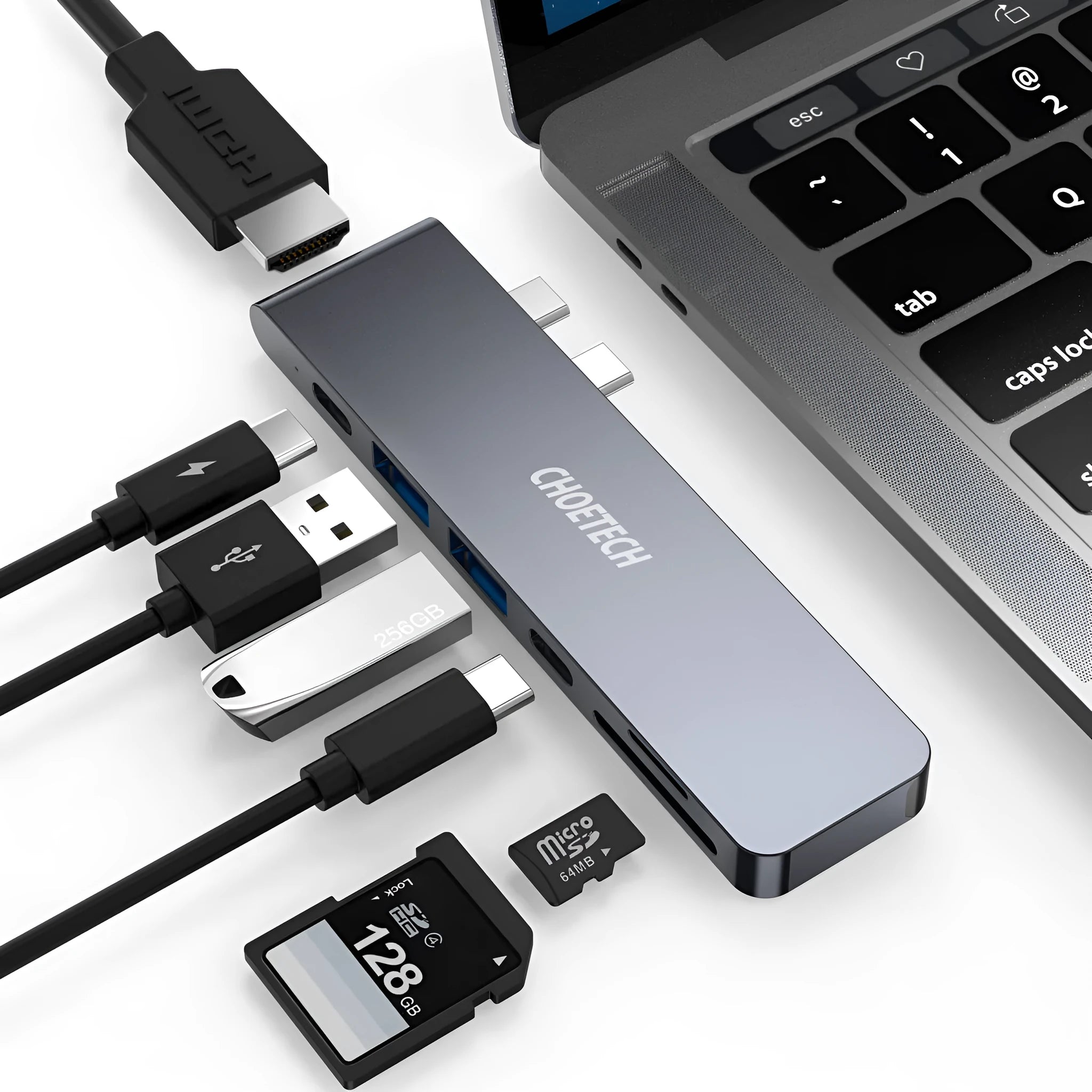 Silver aluminium alloy USB-C multi-port hub with SD card slot, HDMI, and USB ports.