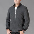 Men's grey sport fleece jacket with long sleeves and a stick pocket, shown on a hanger.