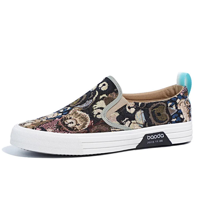 A pair of low-top canvas slip-on sneakers with a round toe and vulcanised rubber sole on a neutral background.