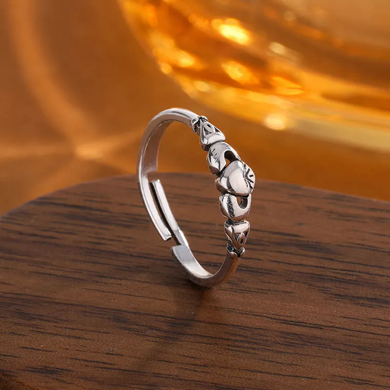 Retro silver copper open ring for women featuring a detailed heart shape design on an adjustable band.