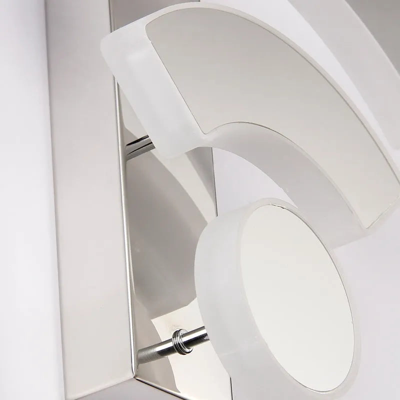 White acrylic WIFI-shaped LED wall light with warm white light on a beige wall