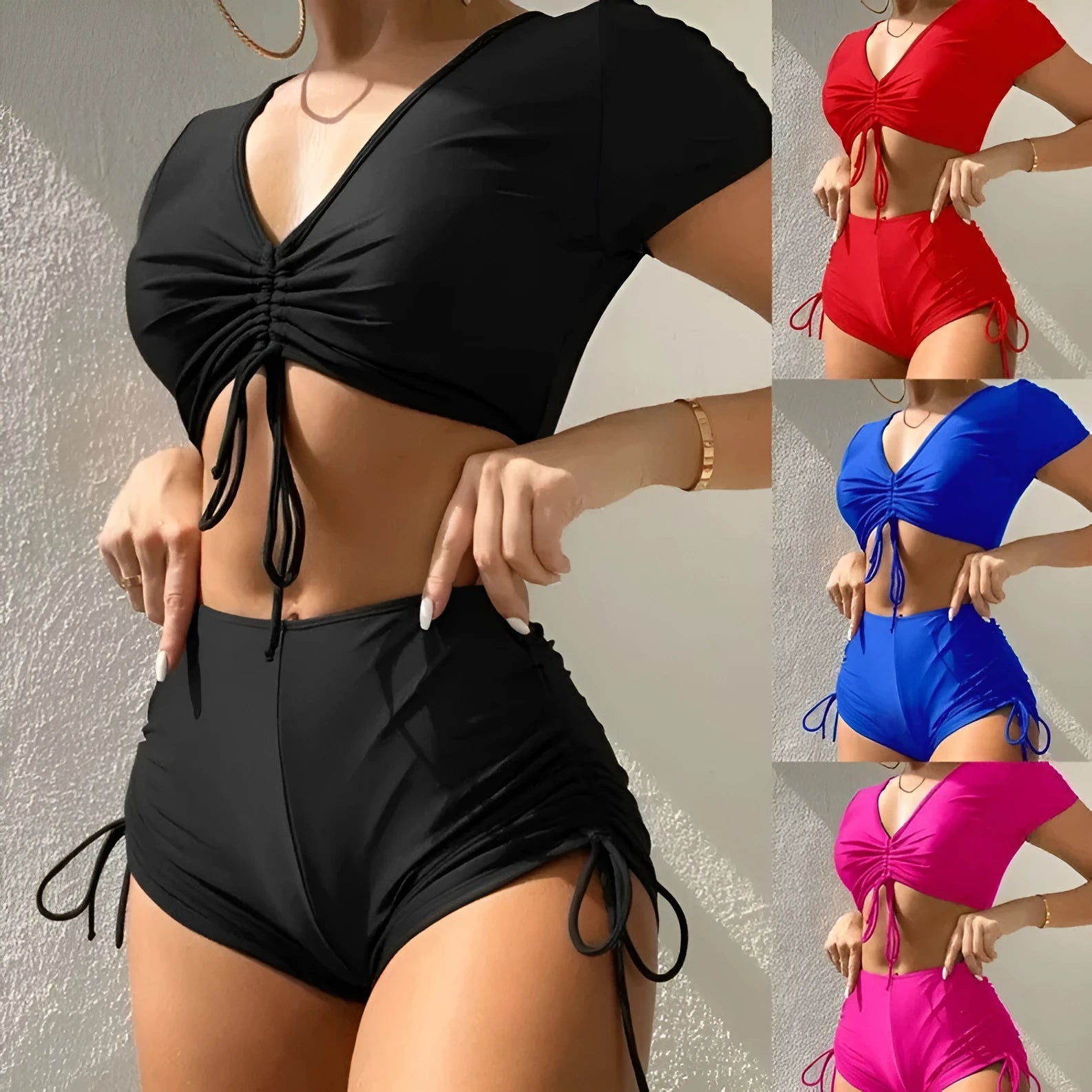 Women's dark green lace-up bow swimsuit top with matching shorts laid flat