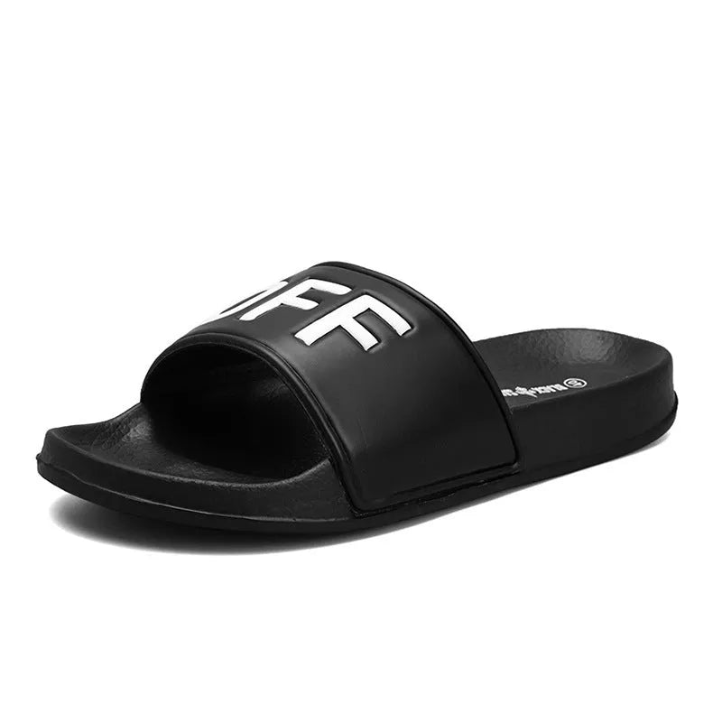 Men's black open-toe slippers with a soft viscose upper and textured rubber sole.