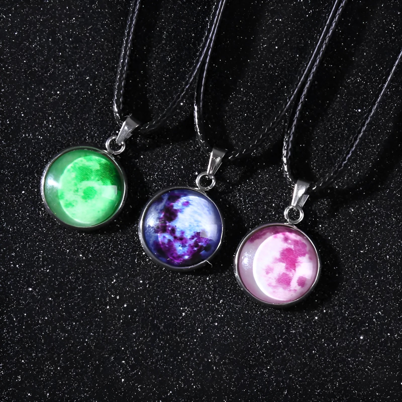 Luminous alloy moon and constellation pendant necklace with a coloured glass cabochon on a chain.