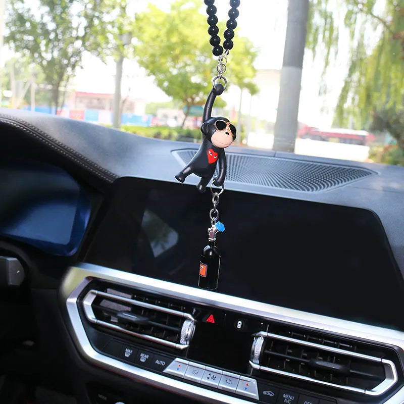 Cartoon monkey wearing sunglasses rearview mirror pendant on a bead necklace.