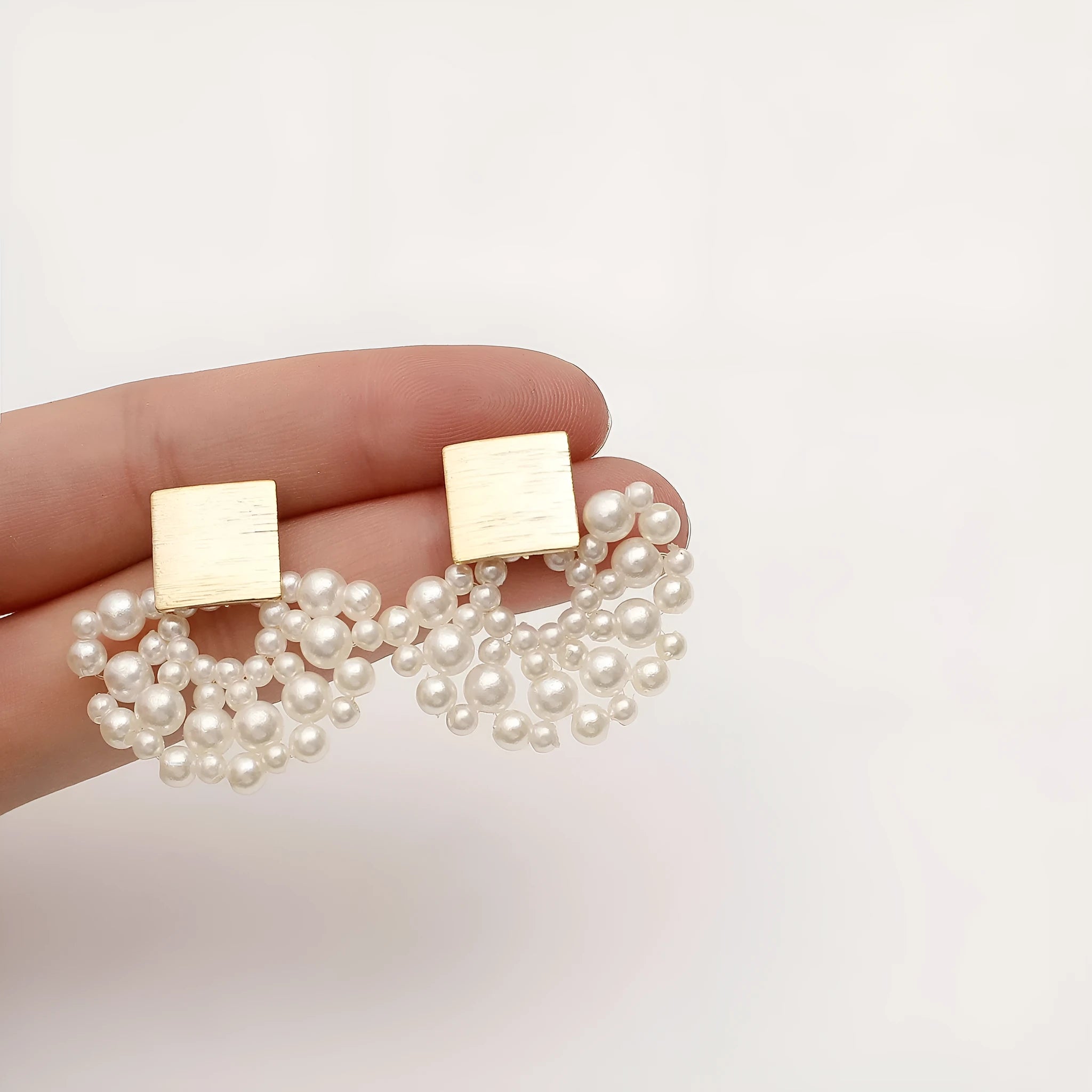 Handmade pearl woven scalloped stud earrings in 14K true gold electroplated alloy with inlaid pearls