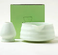 Ceramic Japanese style tea whisk stand in green or pink, listed size 53*40*46, holding a matcha whisk upright