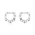 Sterling silver geometric drop earrings with round retro design elements