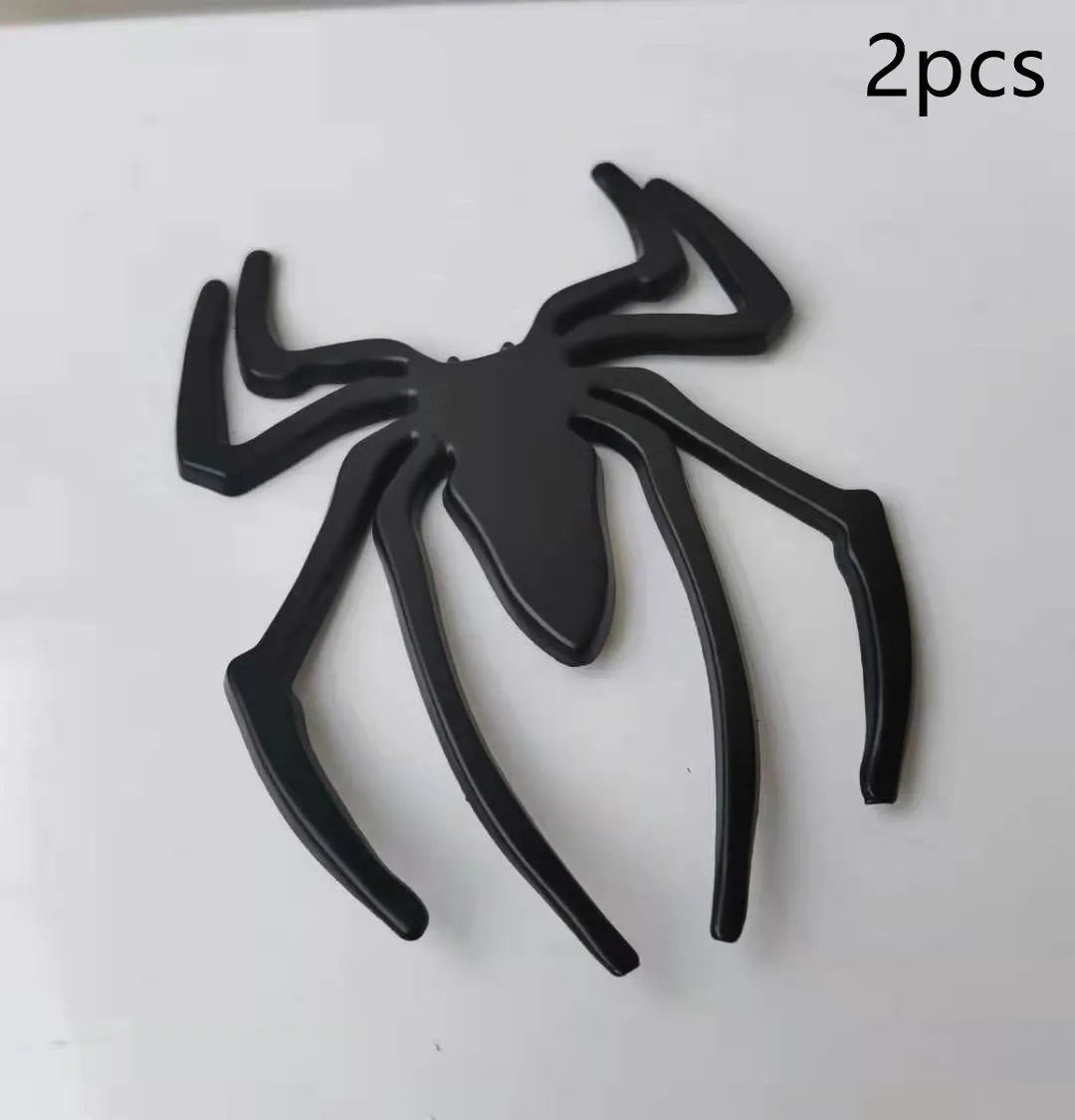 Three-dimensional metal spider car sticker in zinc alloy on a vehicle bumper.