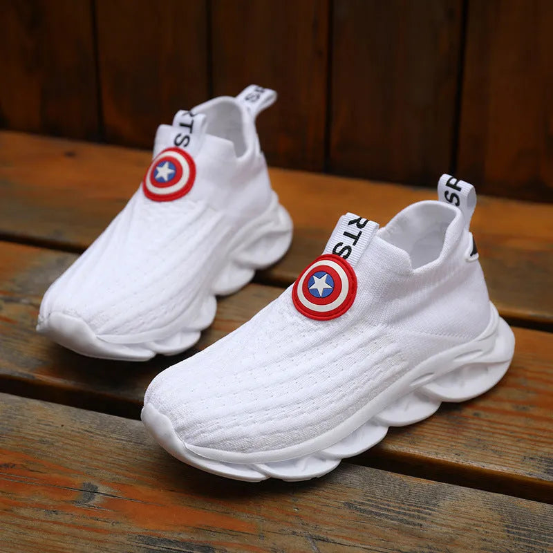 Children's black and white knitted overshoes with sleeve opening for runway or dance performances.