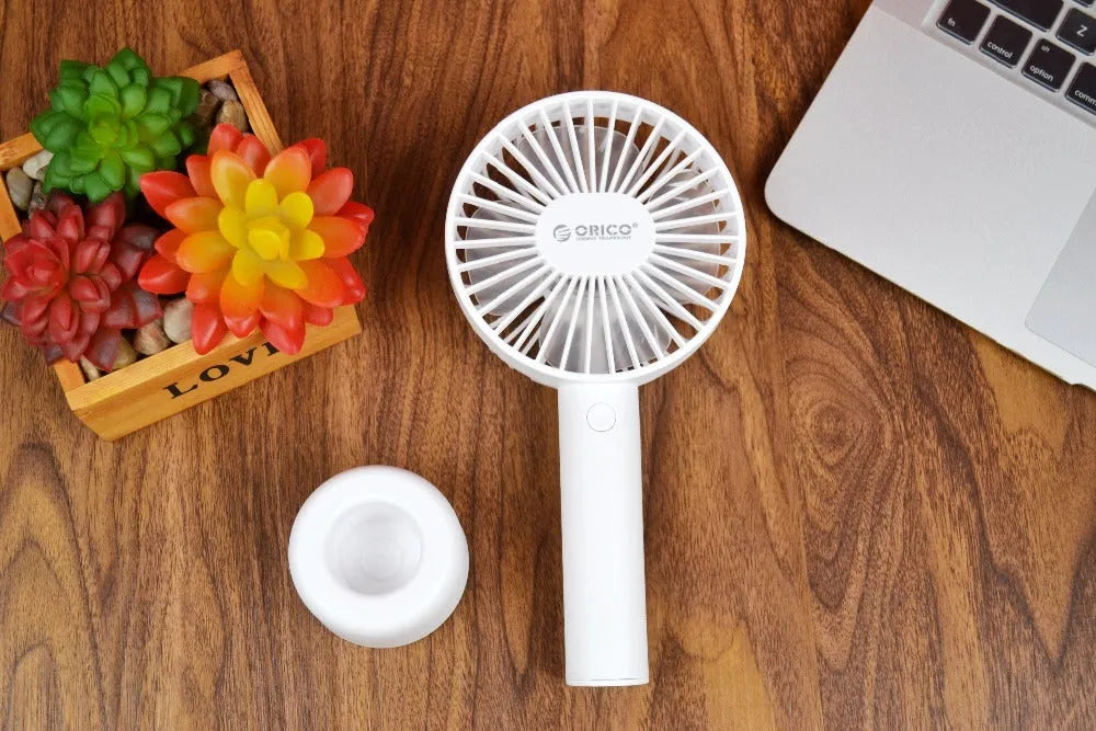 White ORICO FH1 portable USB rechargeable desk fan on a table