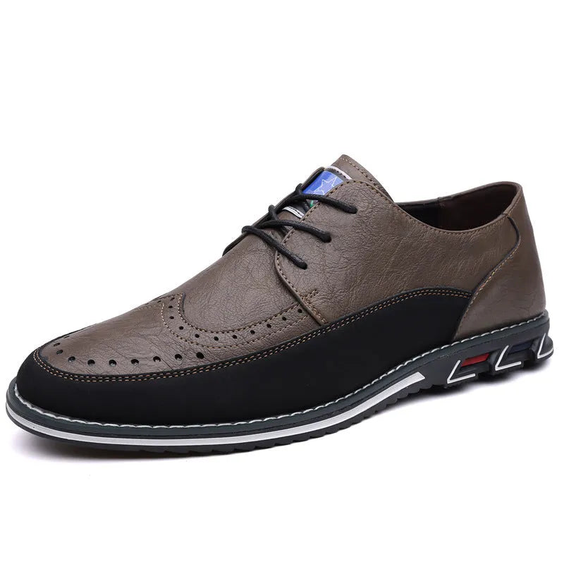 Men's black leather-toe casual shoes with fabric upper and rubber sole on a plain background.