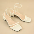 Beige women's square toe sandals with chunky stiletto heel and ankle buckle strap