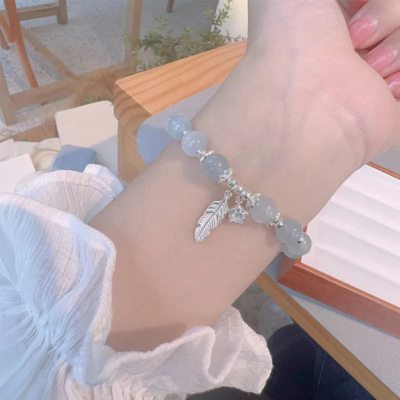 Crystal bracelet with Korean style design featuring letters text in blue moonlight colour