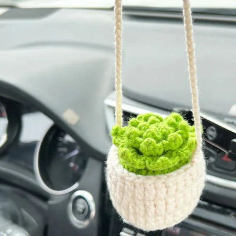 Green and white knitted wool plant ornament for car dashboard with hanging cord