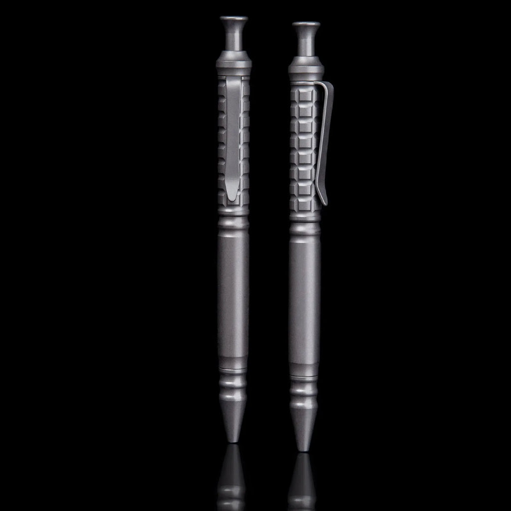 Gunmetal grey titanium tactical pen with push-action decompression mechanism