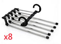 Black stainless steel magic wardrobe hanger with five booms for trousers.