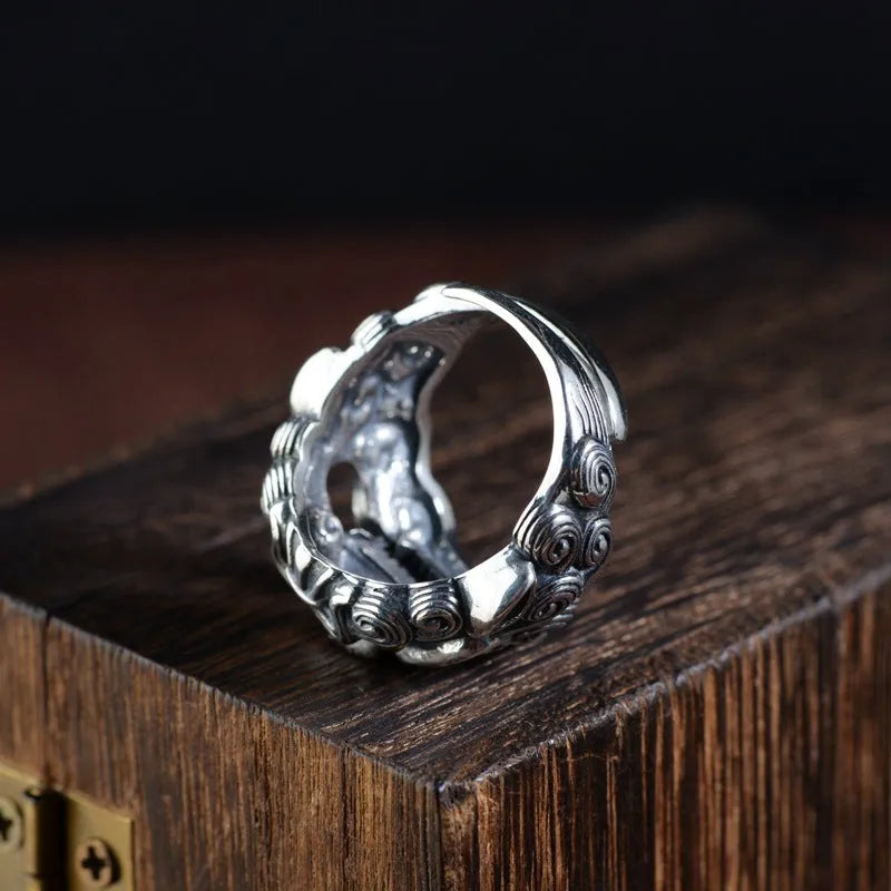 Silver open ring with detailed animal Jibeast pattern and geometric design
