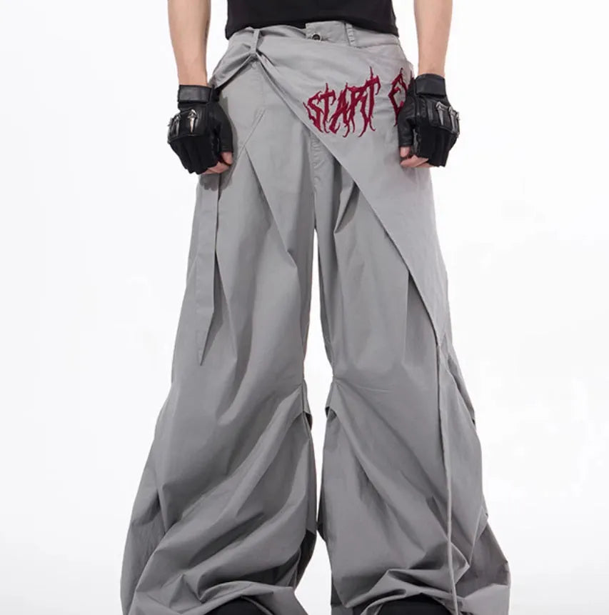 Boy wearing black wide-leg Korean style summer trousers with an elasticated waistband.
