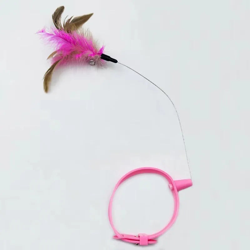 Blue adjustable cat collar with attached feather wand toy and small bell