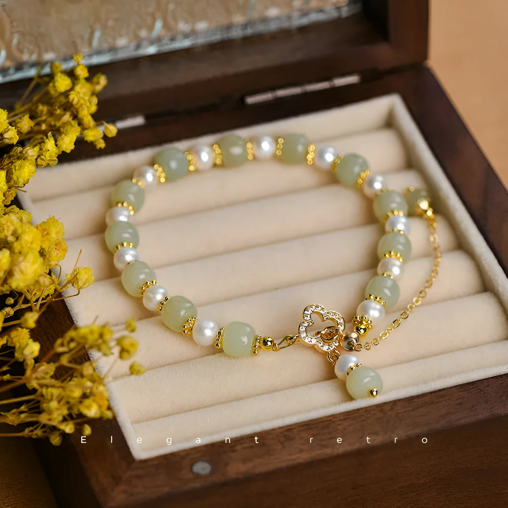 Women's Hetian jade bracelet with pearl pendant and electroplated gold alloy metal in Chinese style