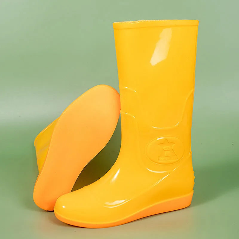 Men's flat washable plastic rain boot in white, showing high tube design and round toe.