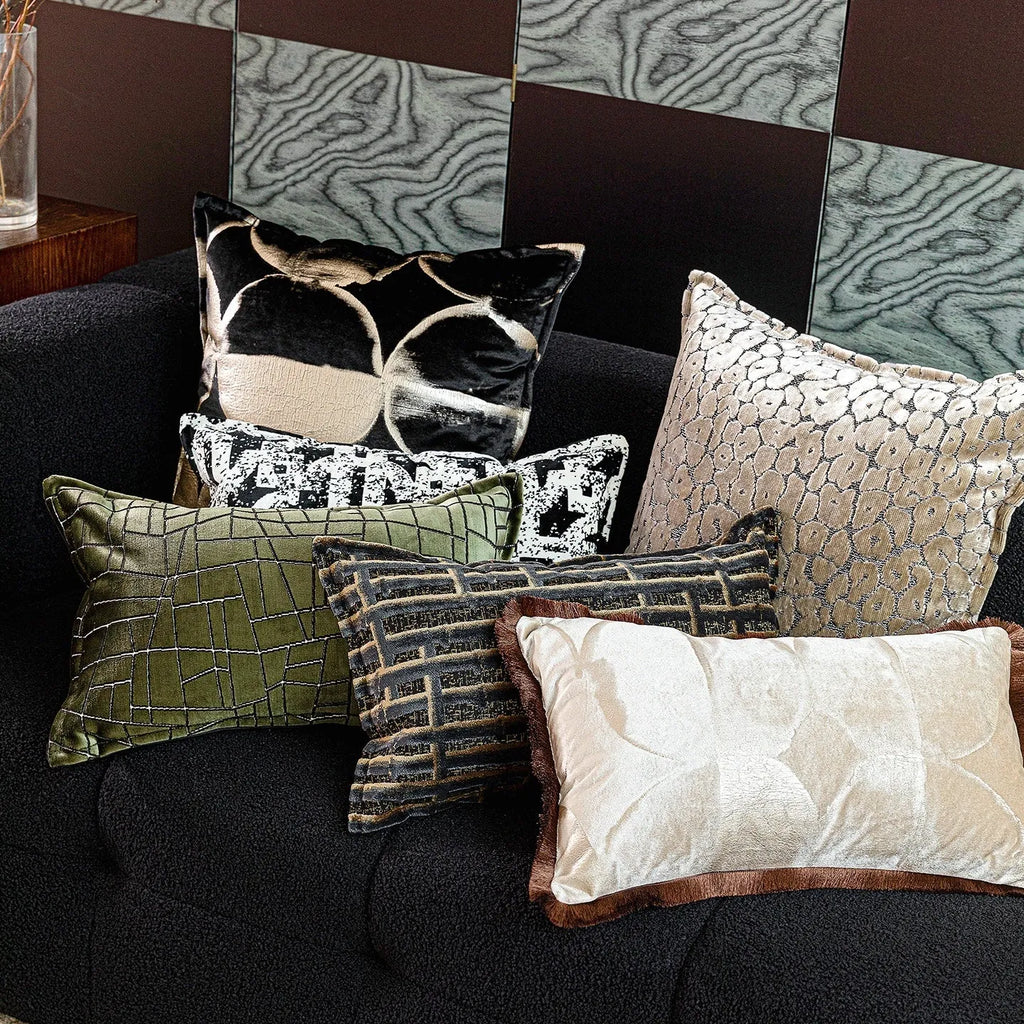 Black gold abstract pattern decorative cushion with removable cover in 45x45cm square size on a grey sofa.