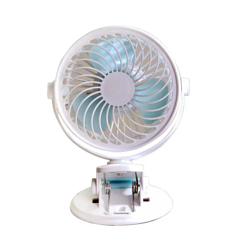 Mini USB desk fan with clip attachment and three blades, shown in desktop setting.