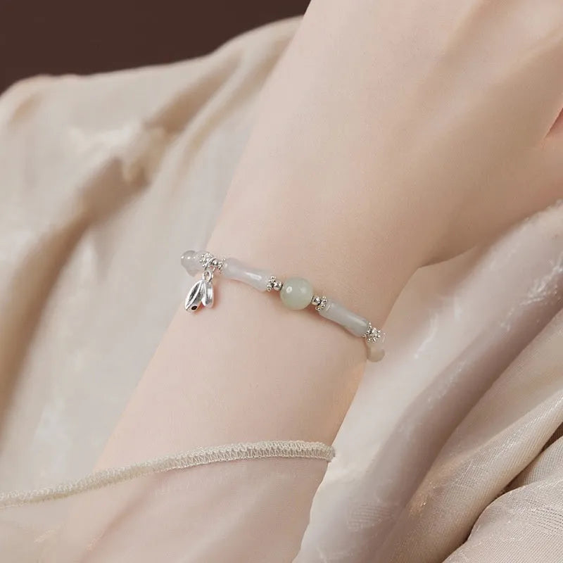 Natural Tianshan green bamboo sterling silver bracelet for women with antique style.